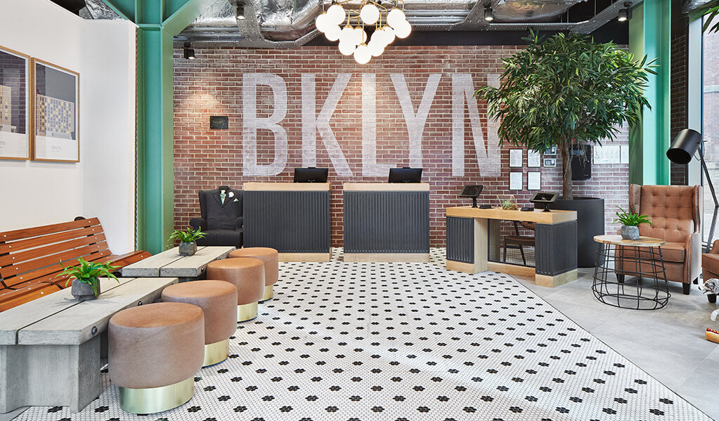 Photo of Hotel Brooklyn reception area including accessible lower check-in desk with knee-clearance