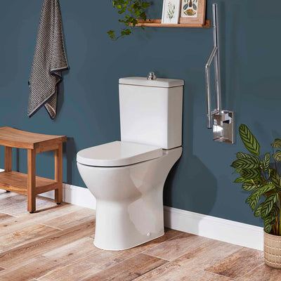Consilio Comfort Height Close Coupled Toilet with the seat cover and cistern lifestyle image
