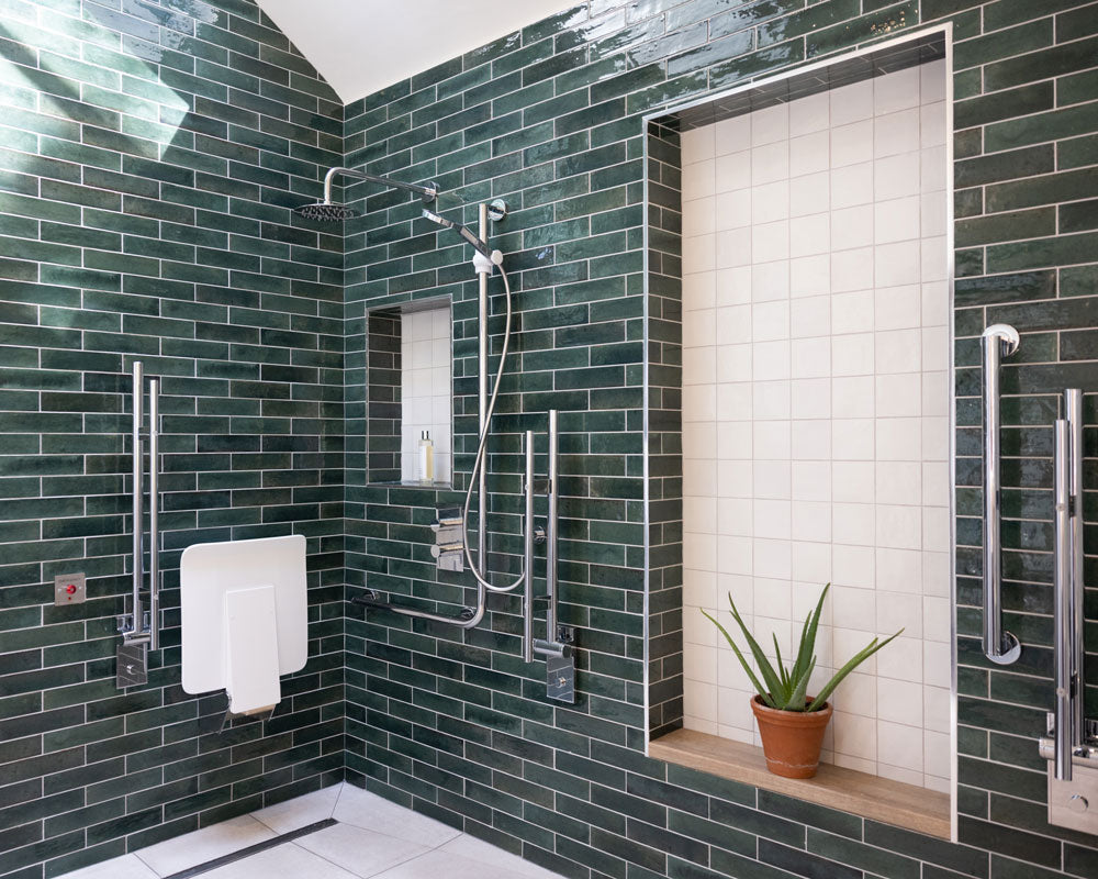 Accessible shower with fold up shower seat and metro tiles