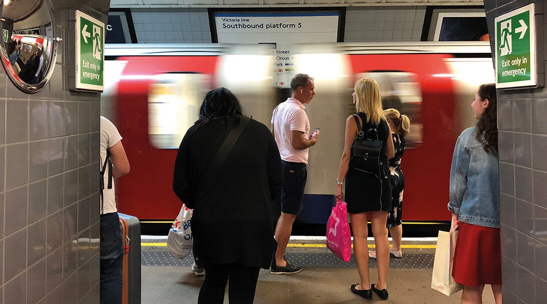 London Underground station with platform of waiting customers